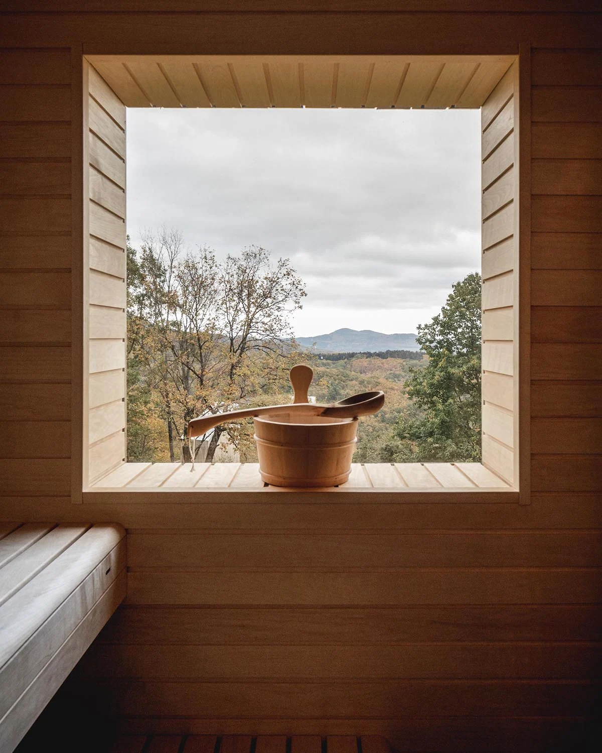 Sauna with built-in benches and a light wood interior