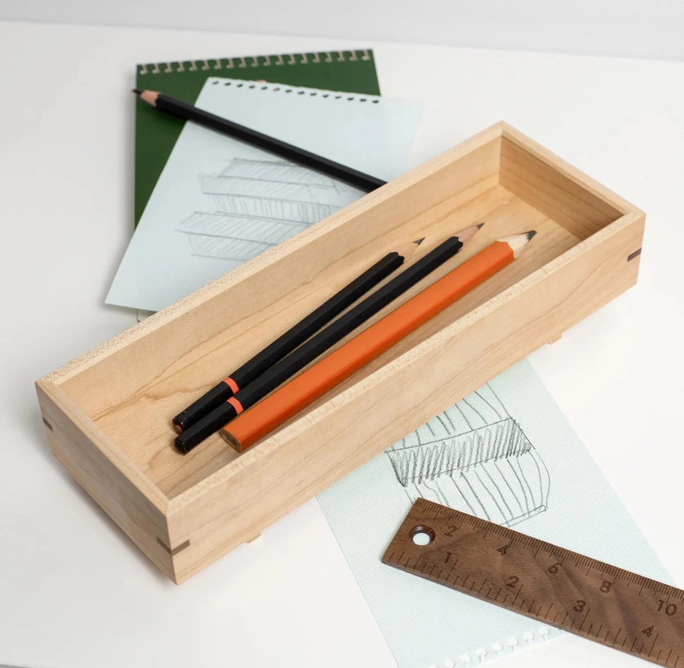 Wooden tray for pens and pencils on a desk