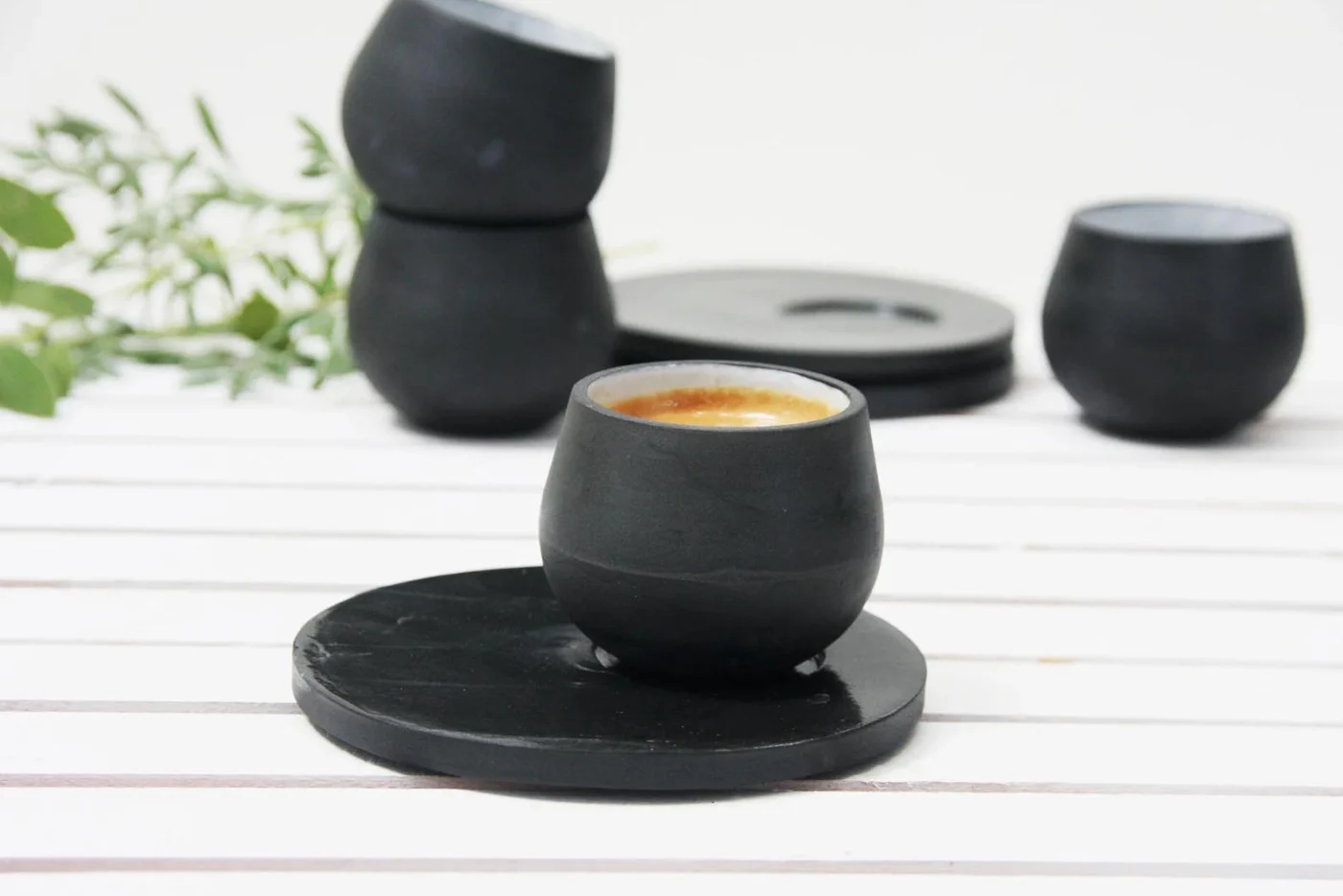 Matte black ceramic espresso cup and saucer