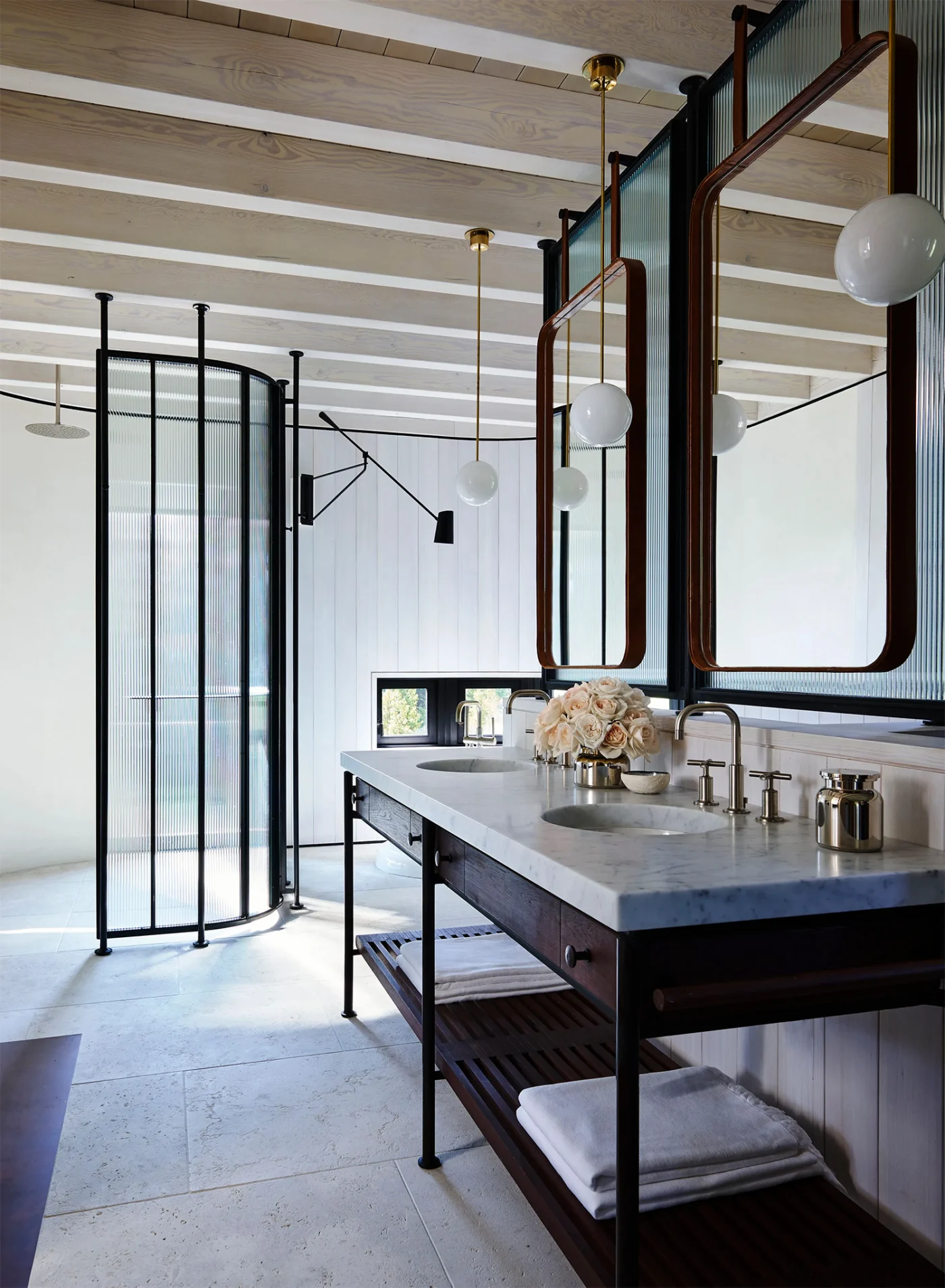 Main bathroom with a custom vanity and glass shower