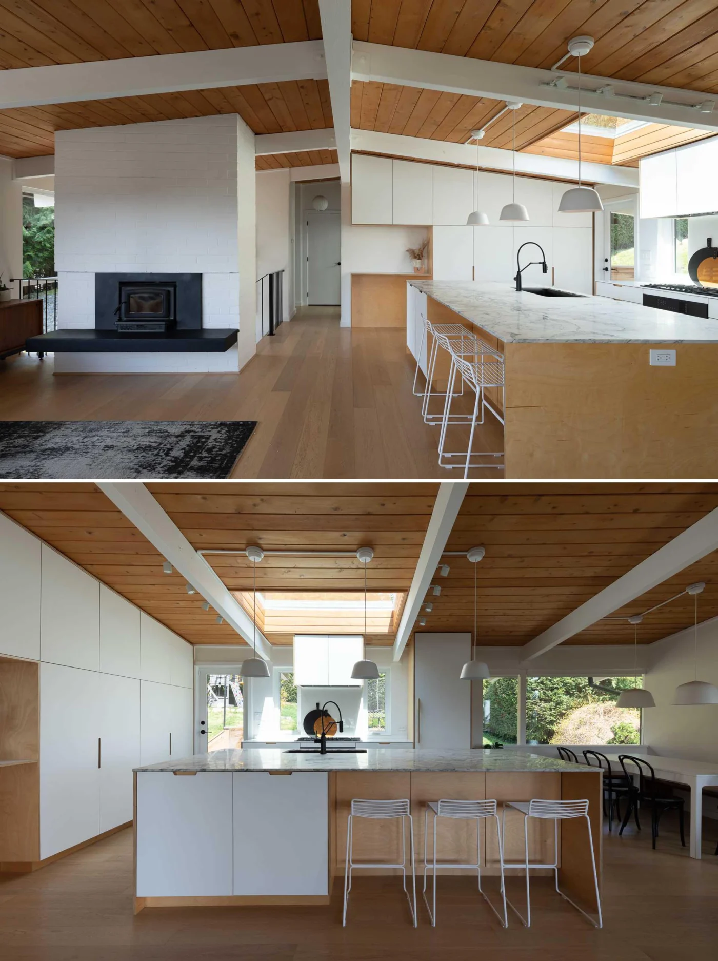 Kitchen with white cabinets and a large marble-topped island