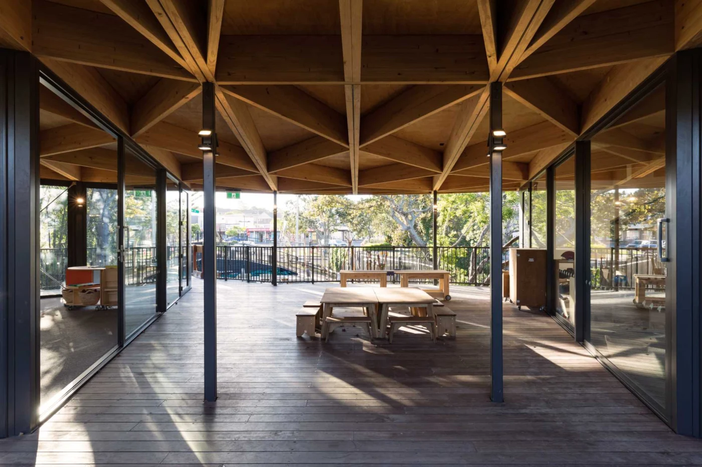 Covered outdoor play area showing the wood roof structure