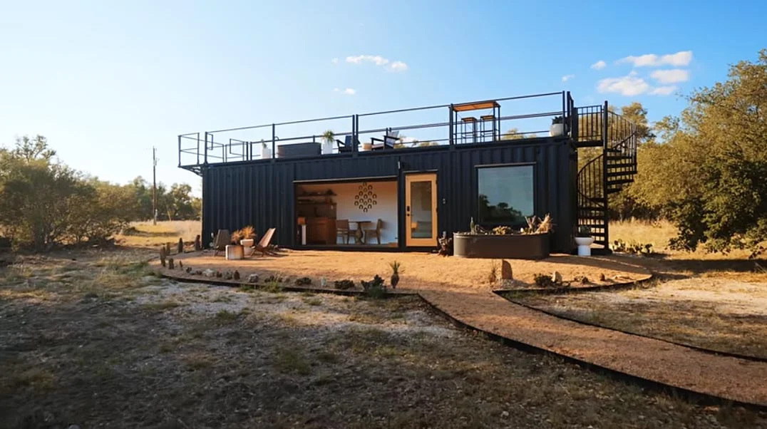 A Spiral Staircase Leads to the Rooftop Deck on This Shipping Container Home