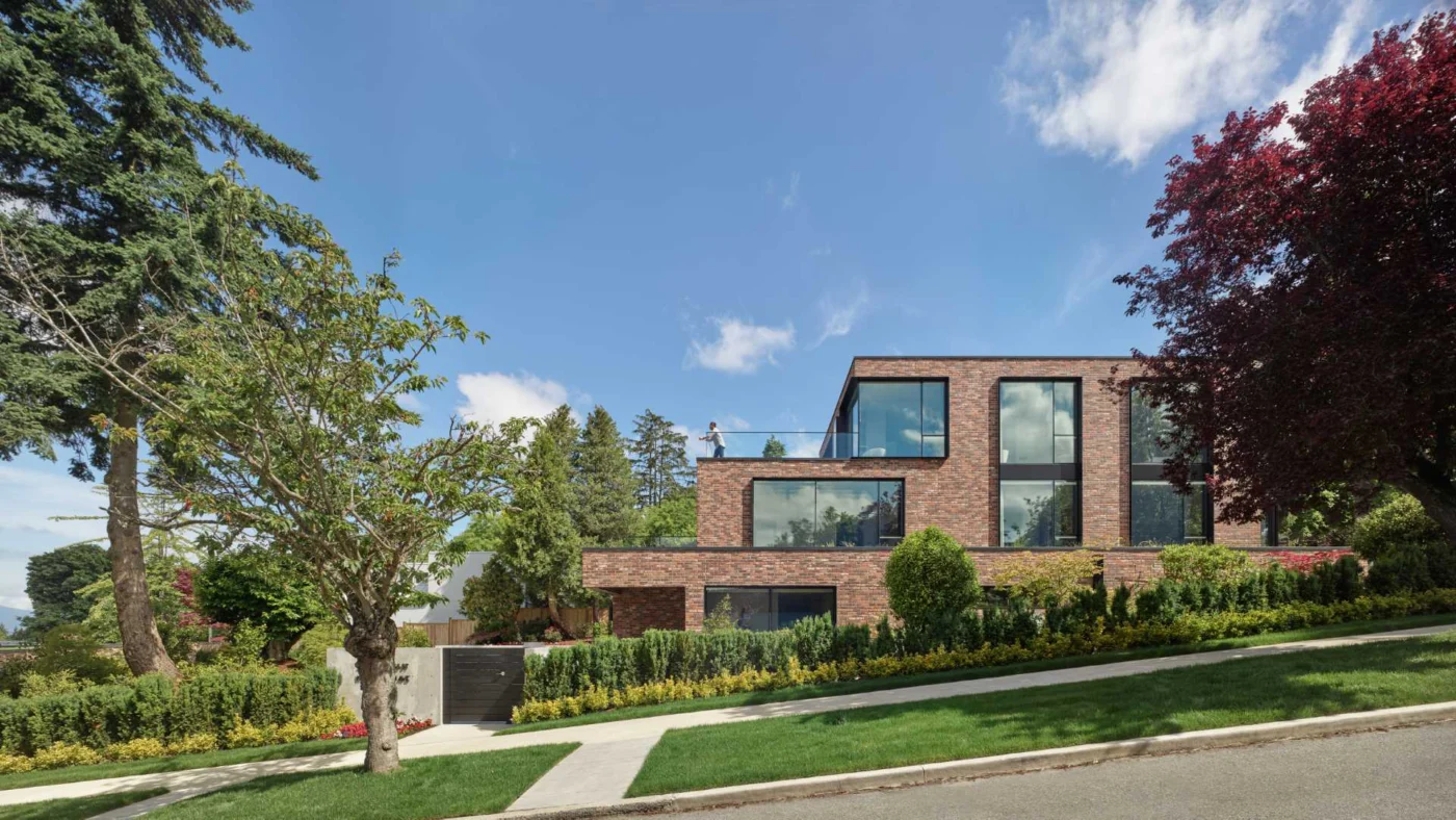 This Modern Brick House Terraces Down the Hillside