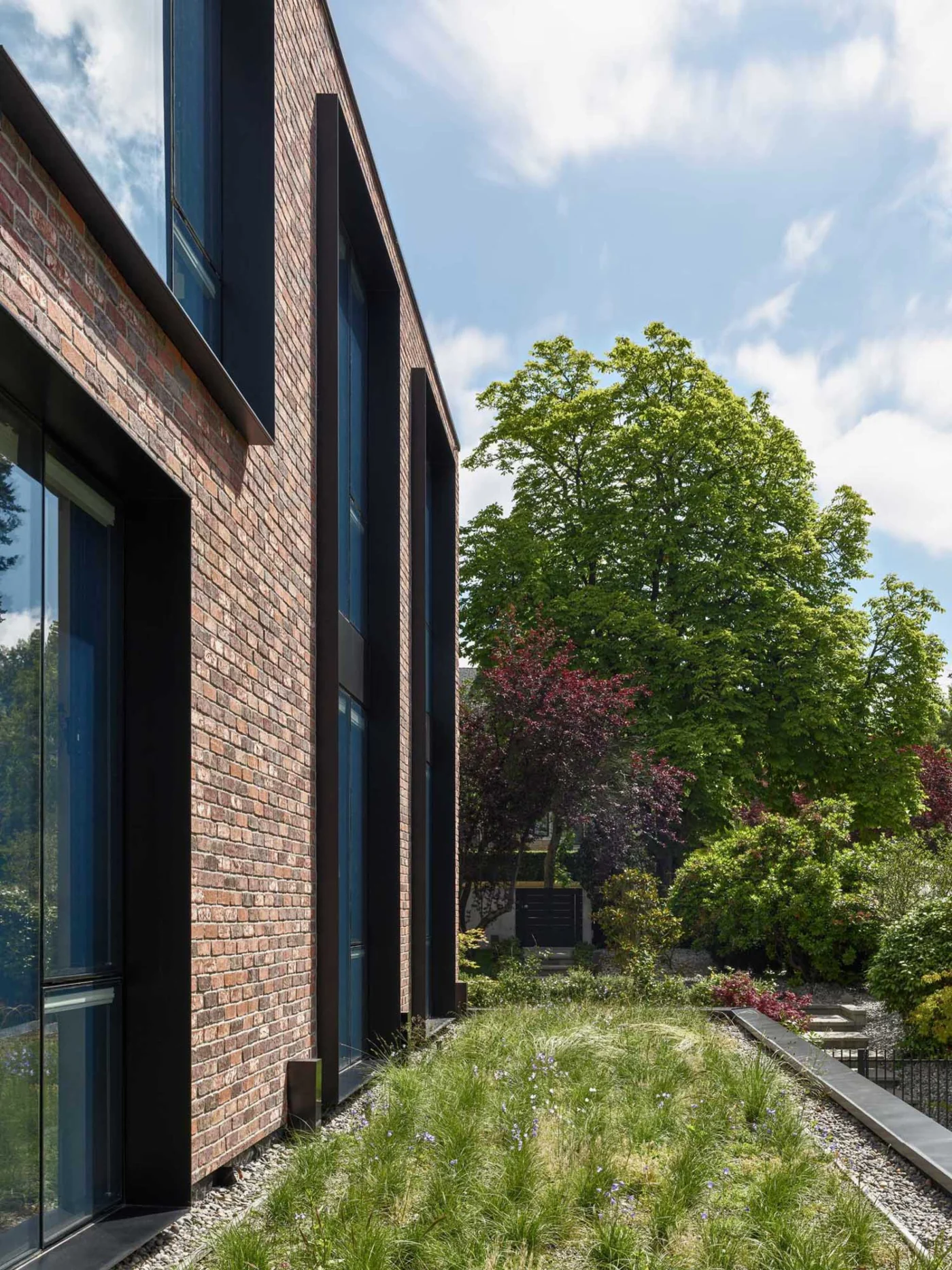 Primary entrance beneath an extensive green roof