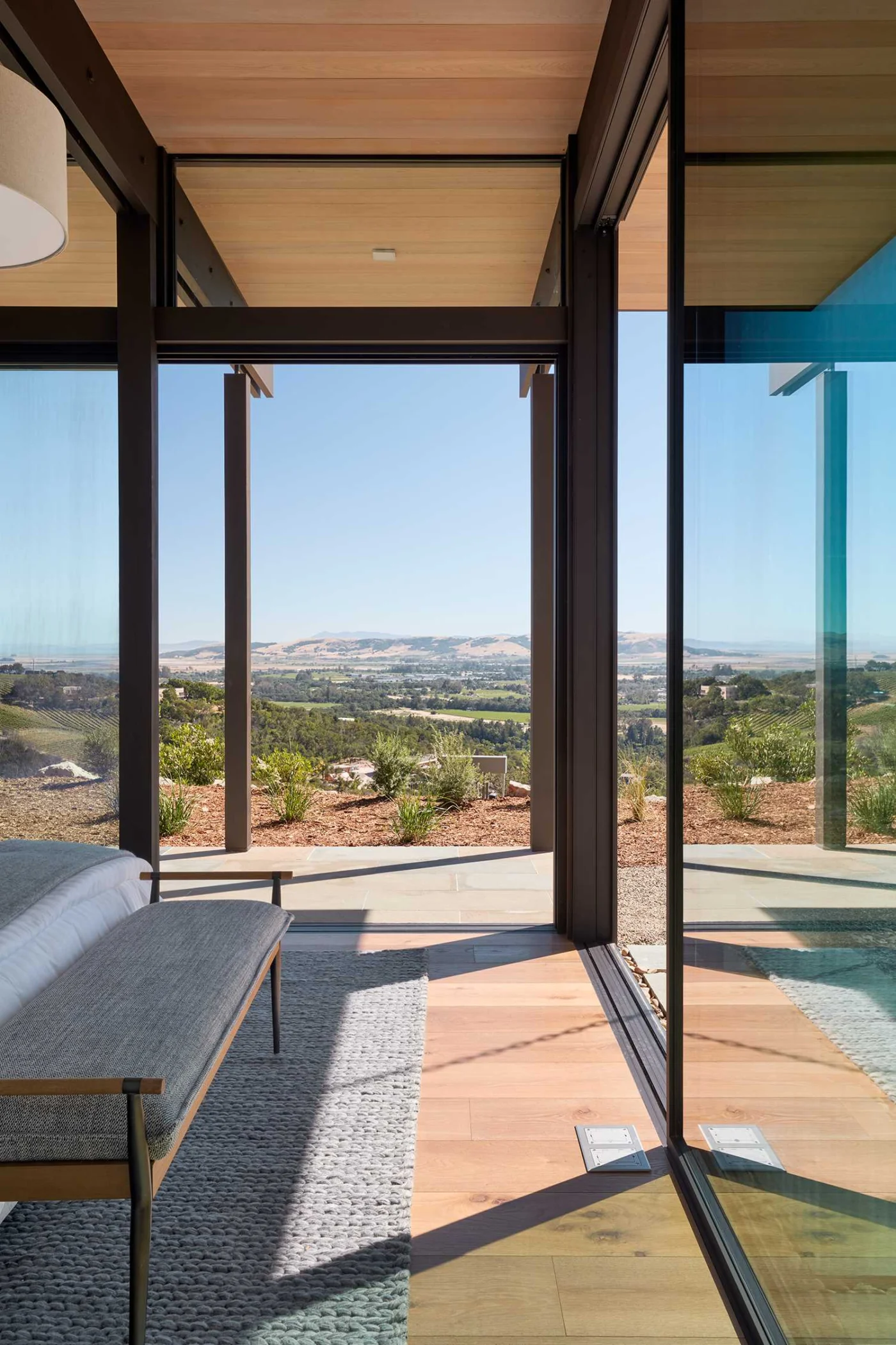 Bedroom with sliding glass doors opening to the outdoors