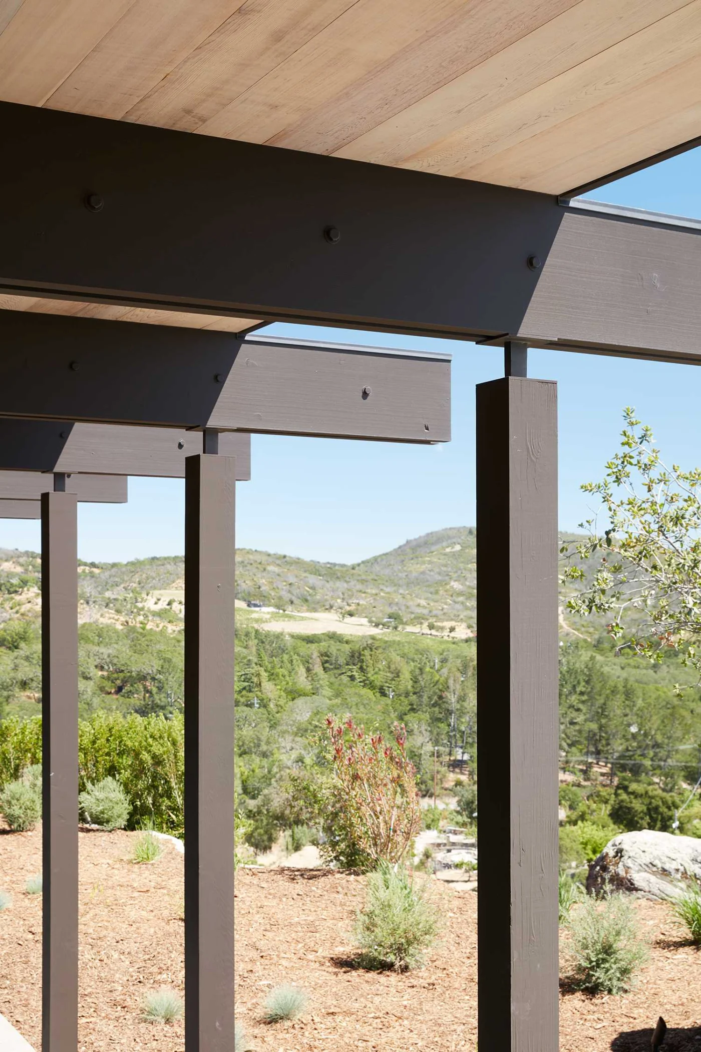 Close view of the exposed post and beam structure