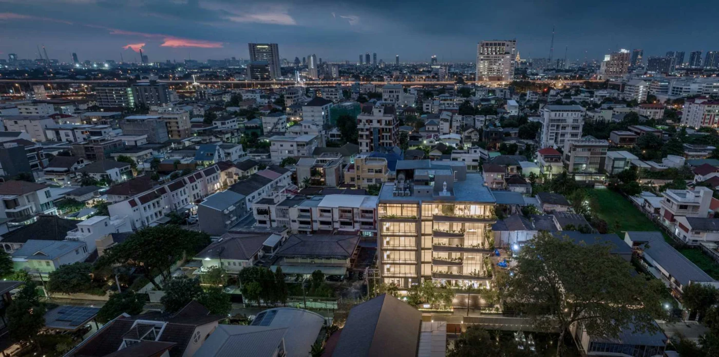 Curved exterior of the Kalm Penthouse Ari condominium building in Bangkok