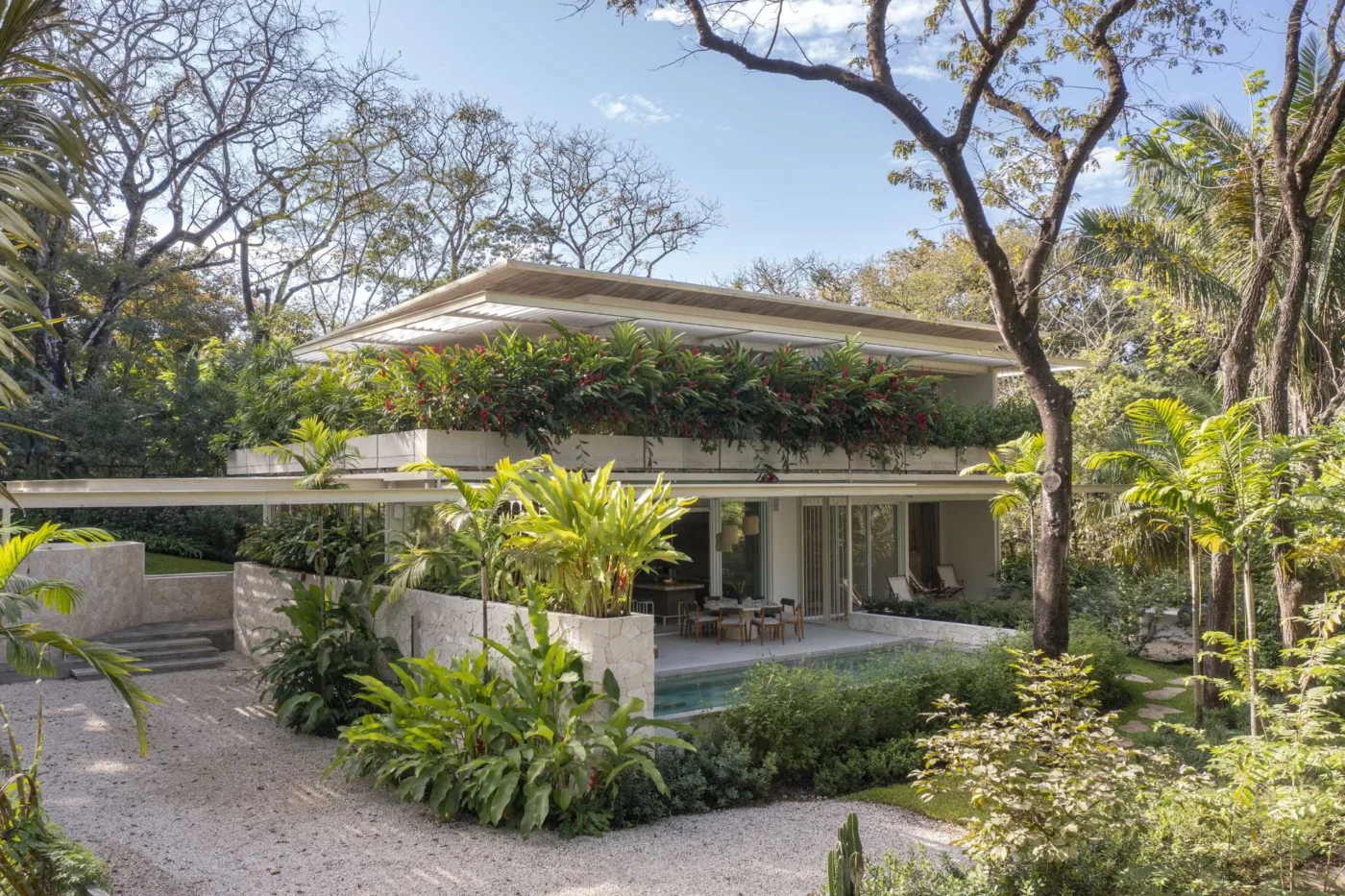 Planter Boxes Were Designed To Help This House To Blend Into Its Tropical Setting