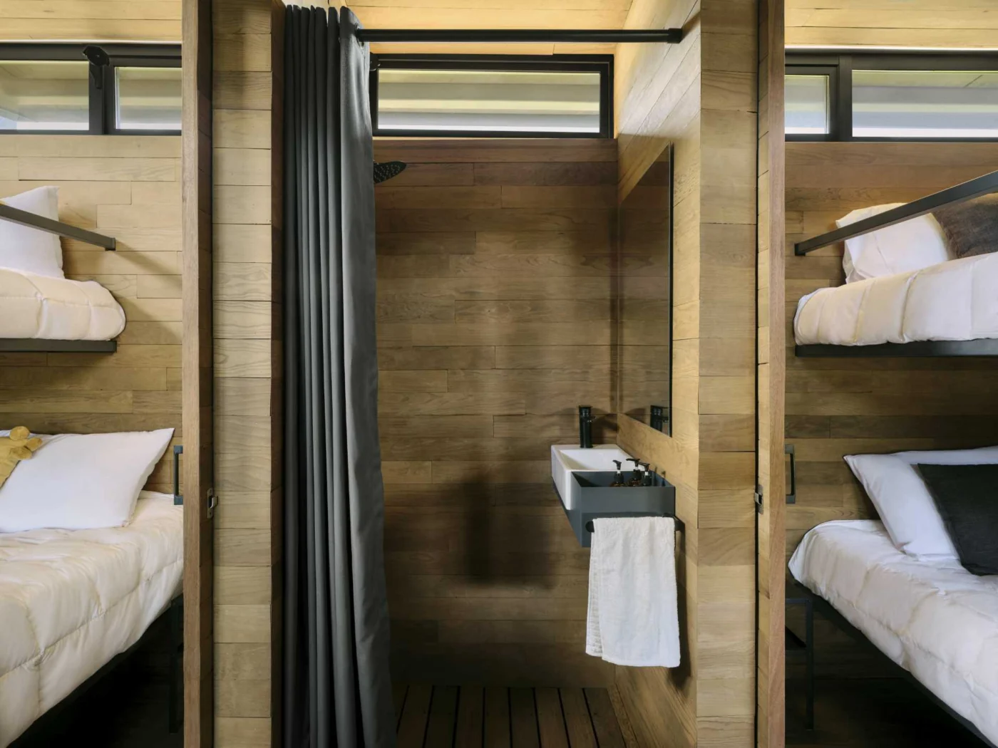 Bathroom set between two bunk bed rooms