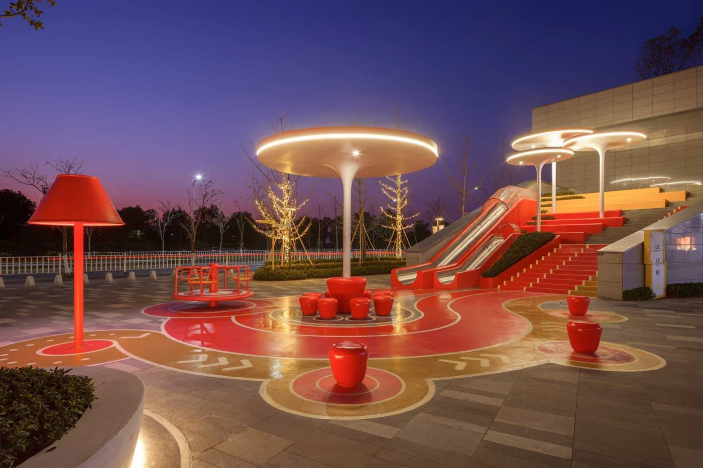Illuminated canopies and seating in the park at night