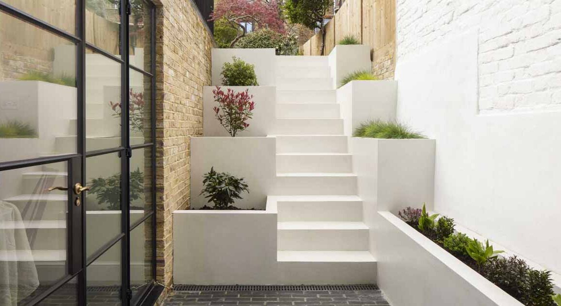 stairs-with-built-in-planters-lead-to-the-back-garden-at-this-home