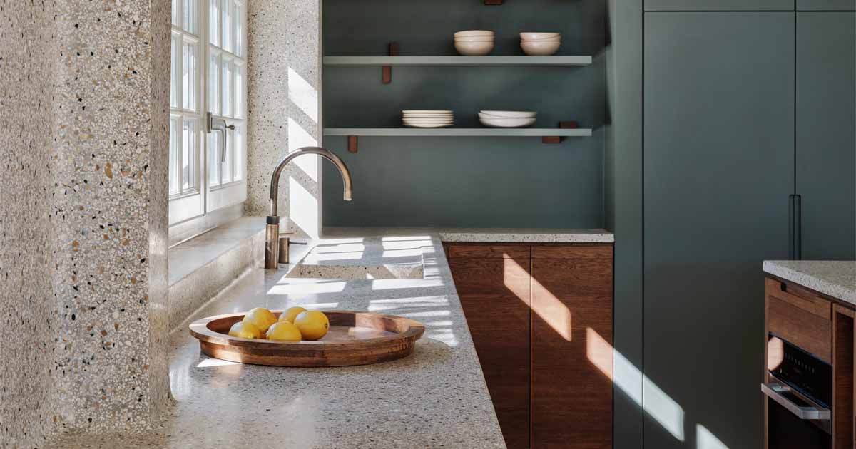 a-seamless-terrazzo-flows-from-the-wall-to-the-countertop-in-this-kitchen