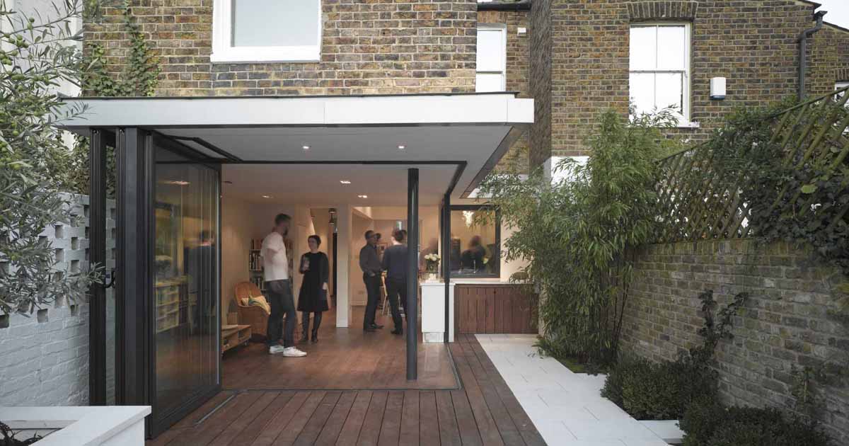 a-home-renovation-where-the-walls-were-removed-so-the-interior-connects-with-the-exterior