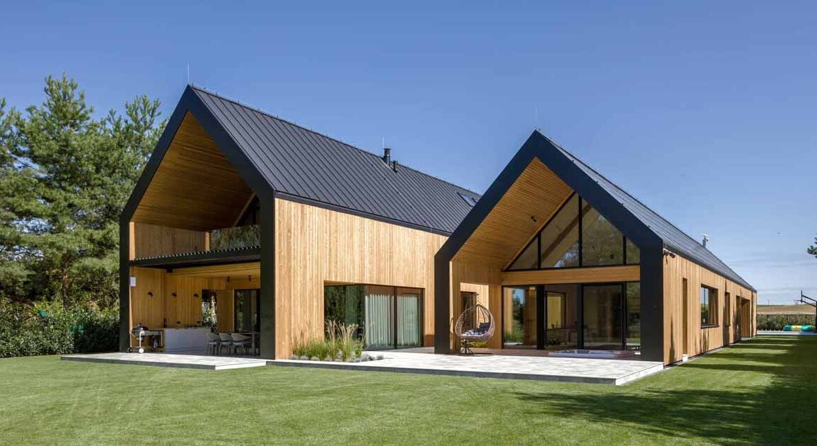 a-house-designed-like-two-barns-beside-each-other