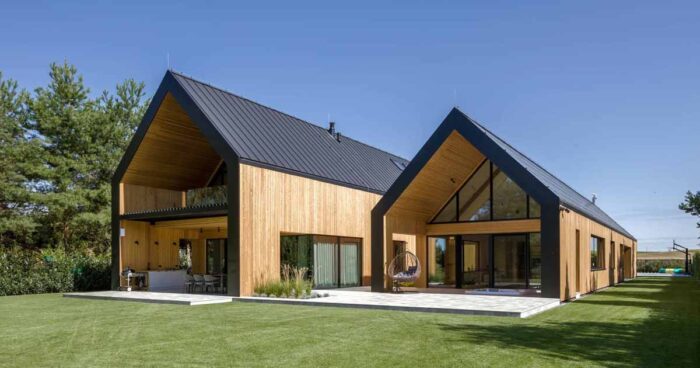 a-house-designed-like-two-barns-beside-each-other