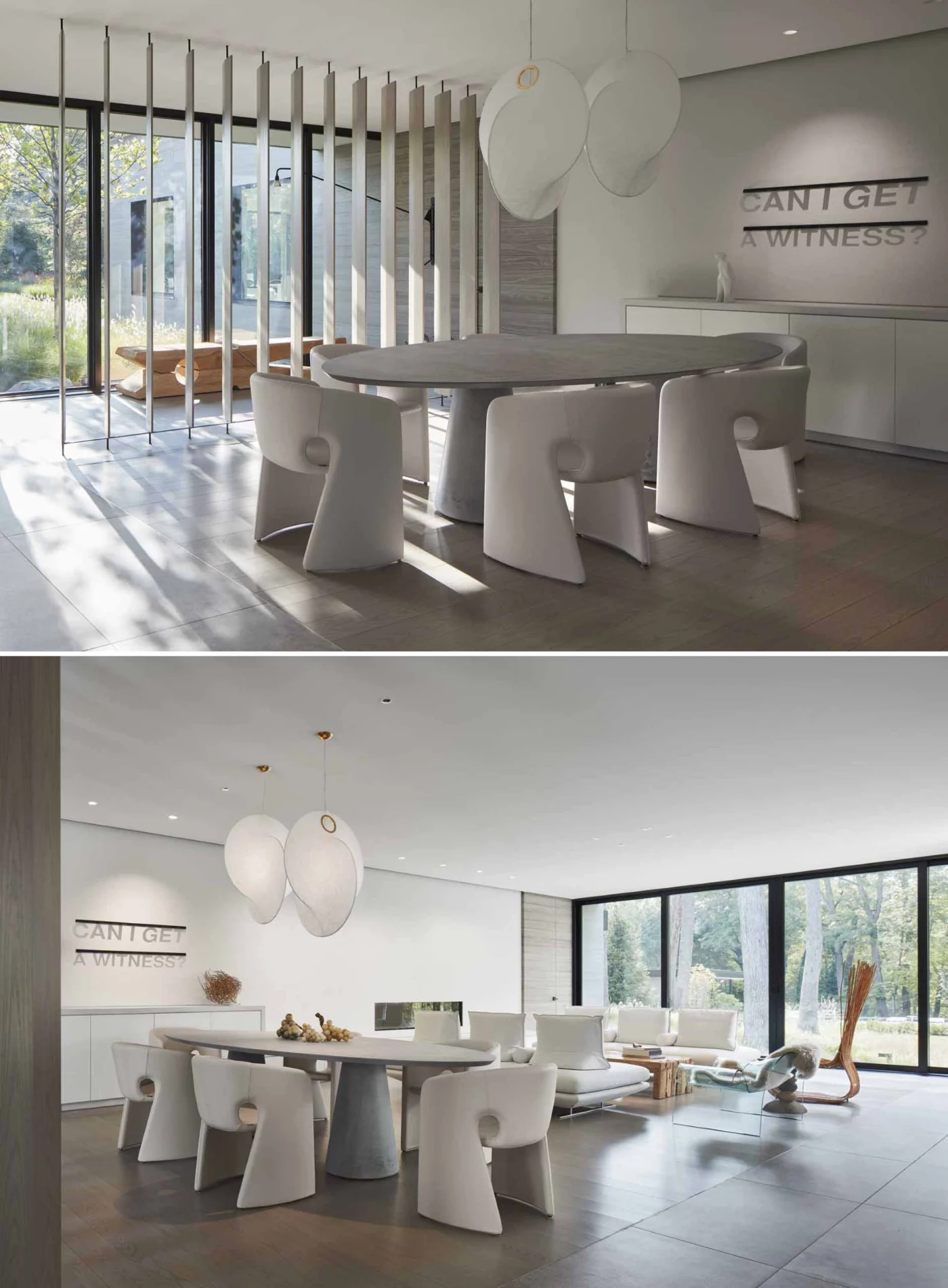 Dining area with an oval table, sculptural pendants and a vertical wood screen