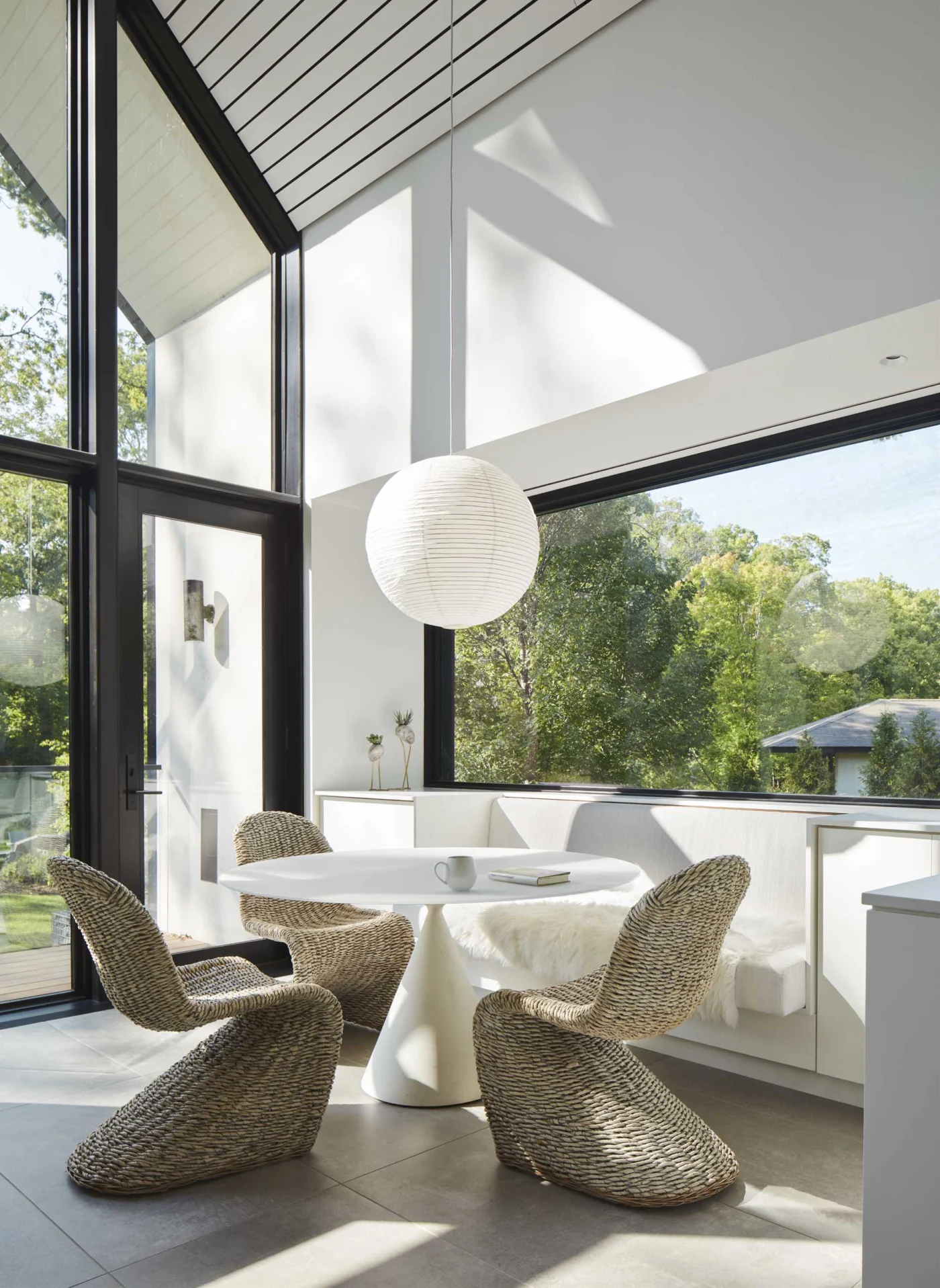Coffee house breakfast nook with built-in seating and garden views