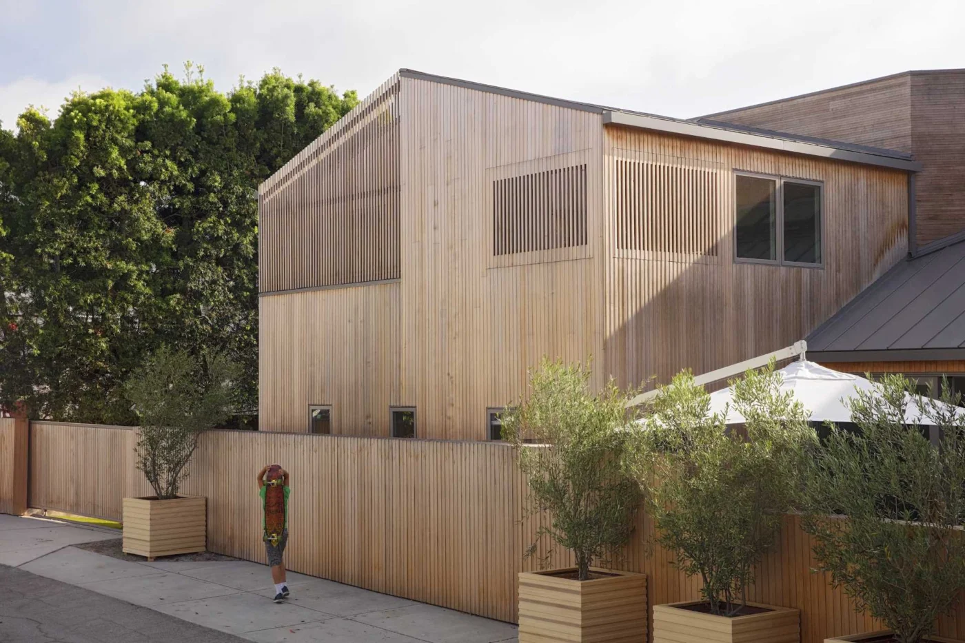 Custom-milled cedar siding wrapping the simplified form of the house