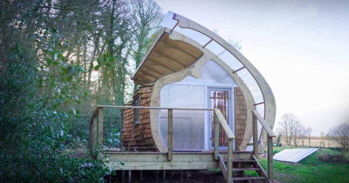 this-small-shingle-clad-cabin-has-an-organic-shape
