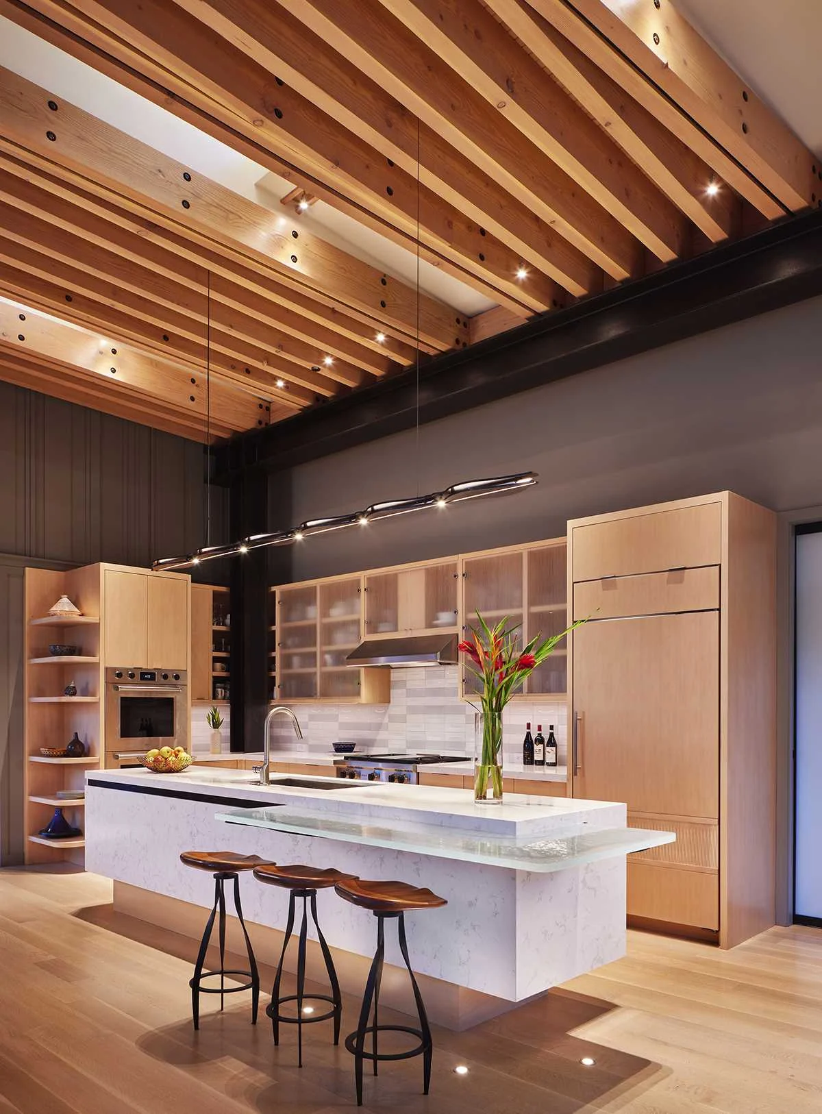 Kitchen with beech cabinets and a white quartzite island