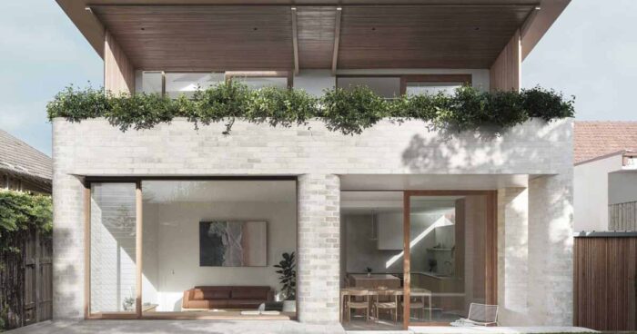 a-material-palette-of-pale-brick,-concrete,-and-timber-echoes-this-home's-coastal-site