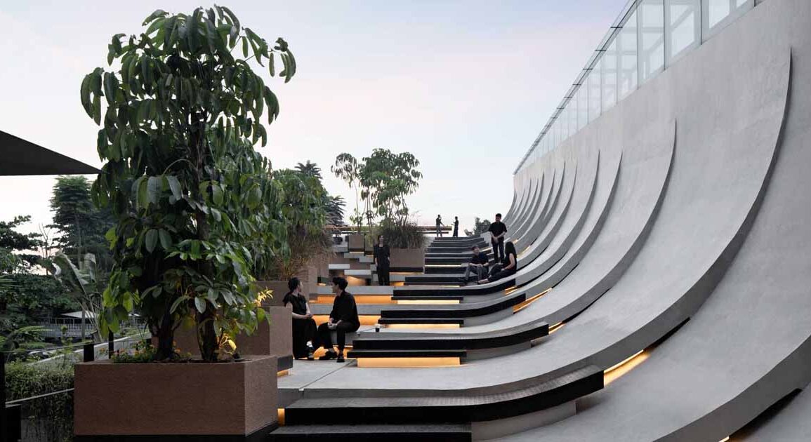 this-building-with-a-split-roof-makes-space-for-a-rooftop-park