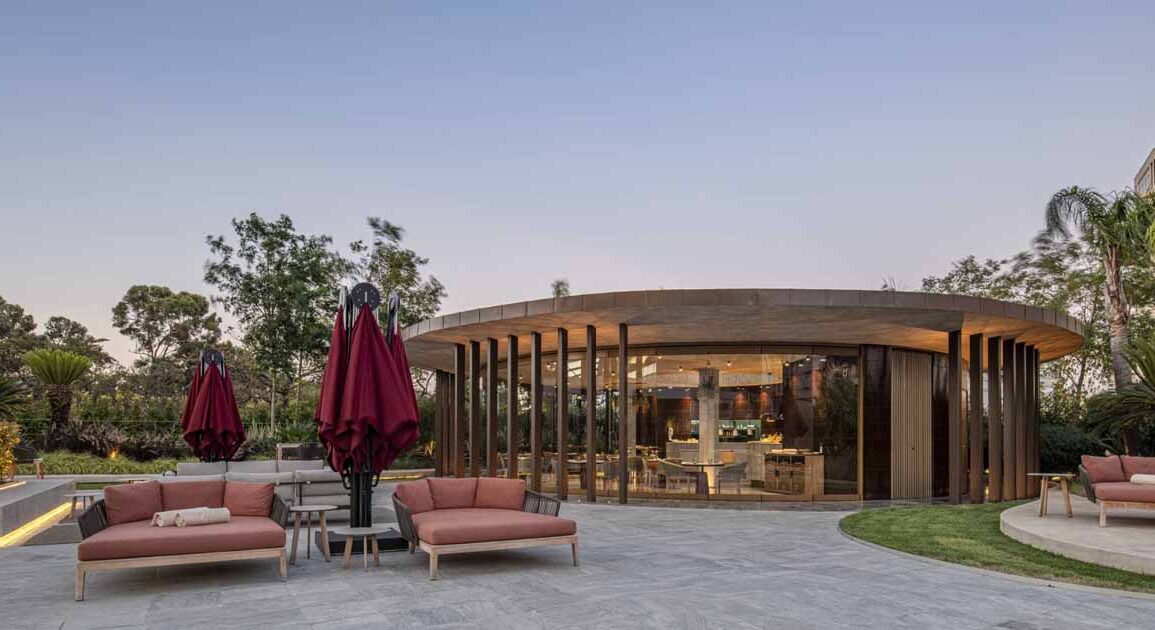 a-concrete-ceiling-floats-above-this-round-hotel-bar