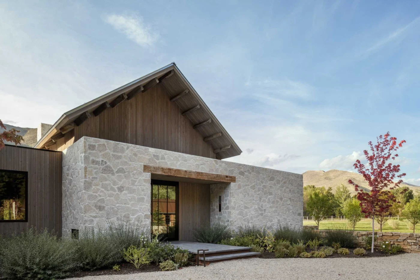 Exterior of the Idaho ranch home combining rustic materials with a modern form