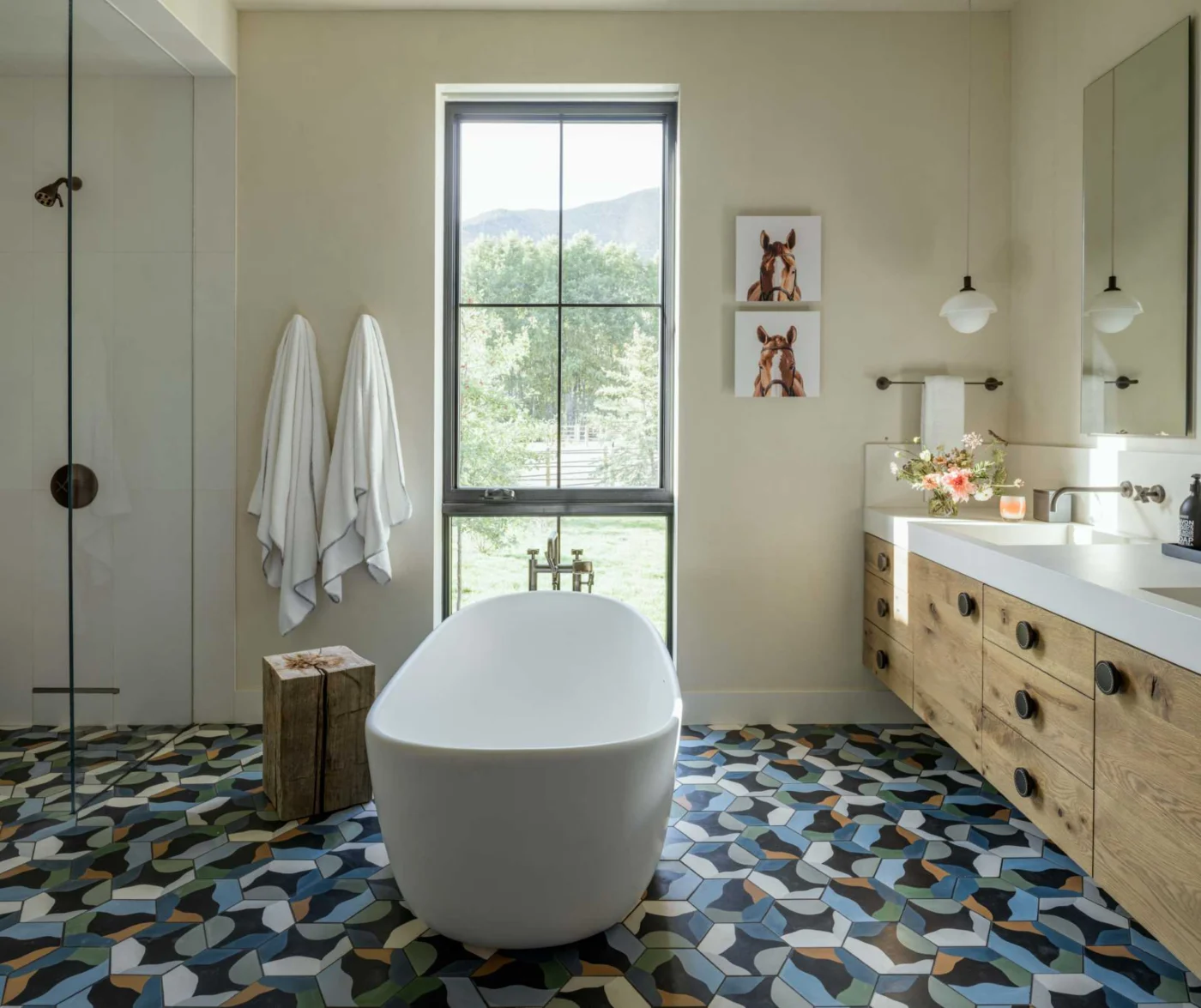 Bathtub placed beside a Dutch window with views outside