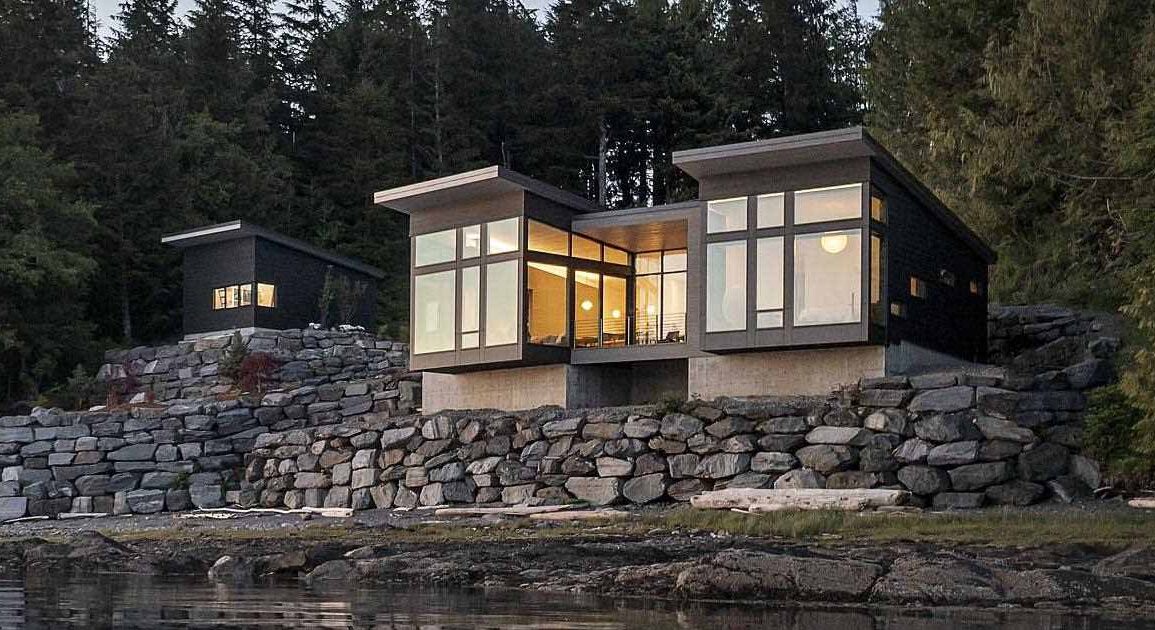 a-new-home-overhanging-the-water's-edge-in-alaska