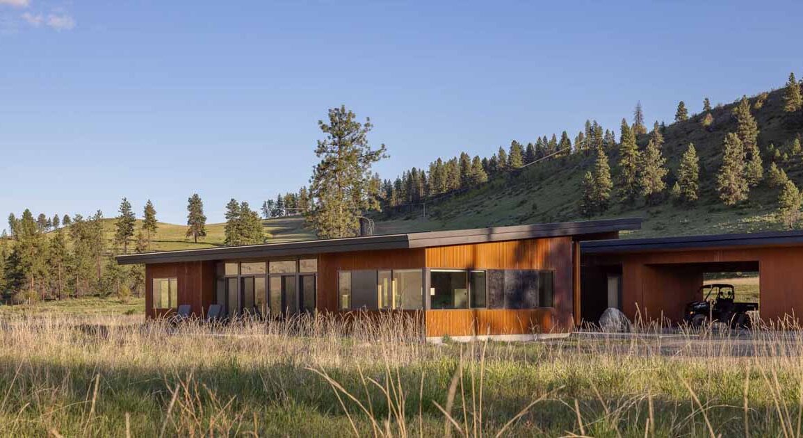 a-weathered-corrugated-metal-exterior-protects-this-home-on-a-ranch