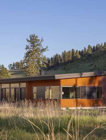 a-weathered-corrugated-metal-exterior-protects-this-home-on-a-ranch