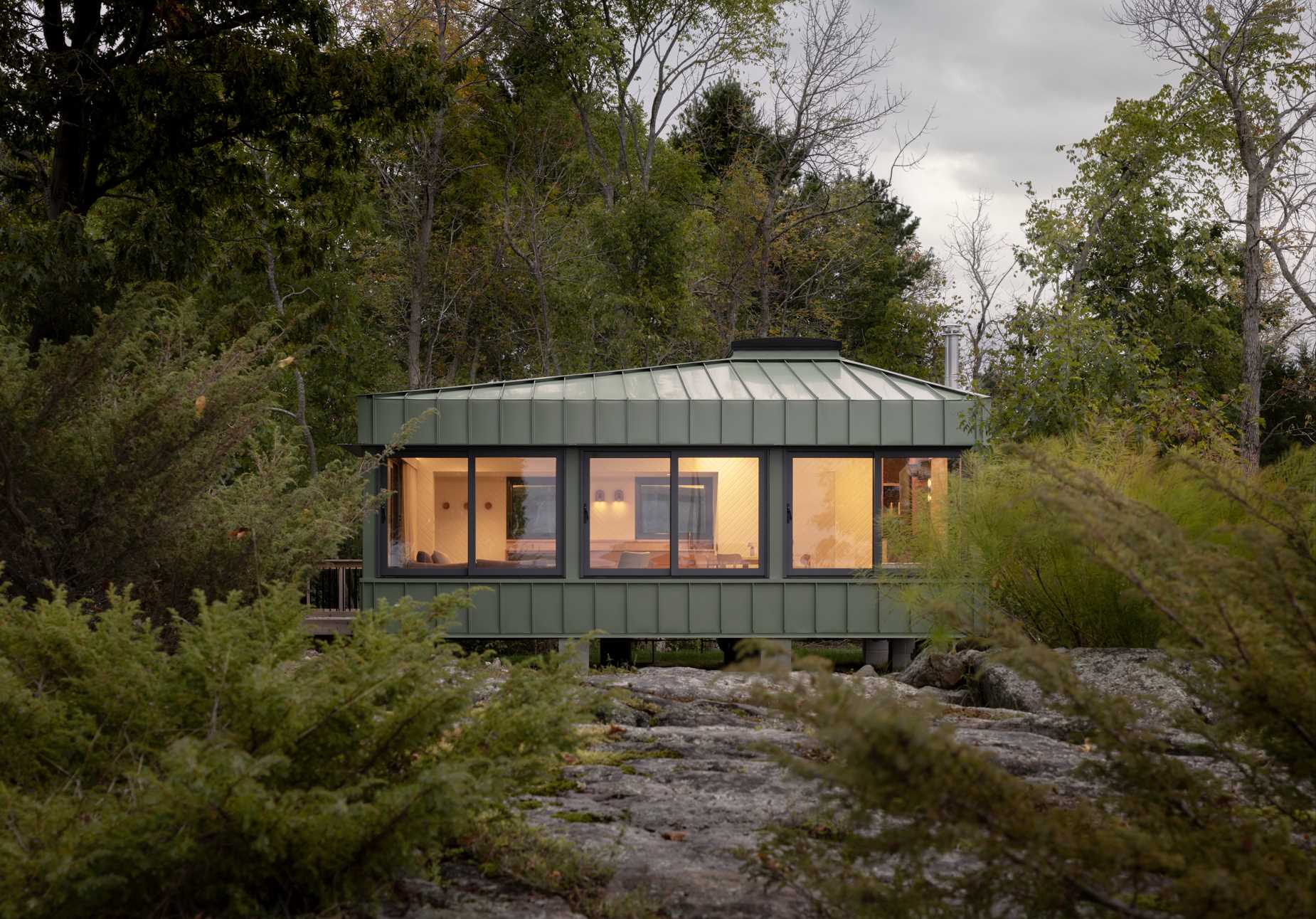 small cabin green metal siding 071124 1052 011