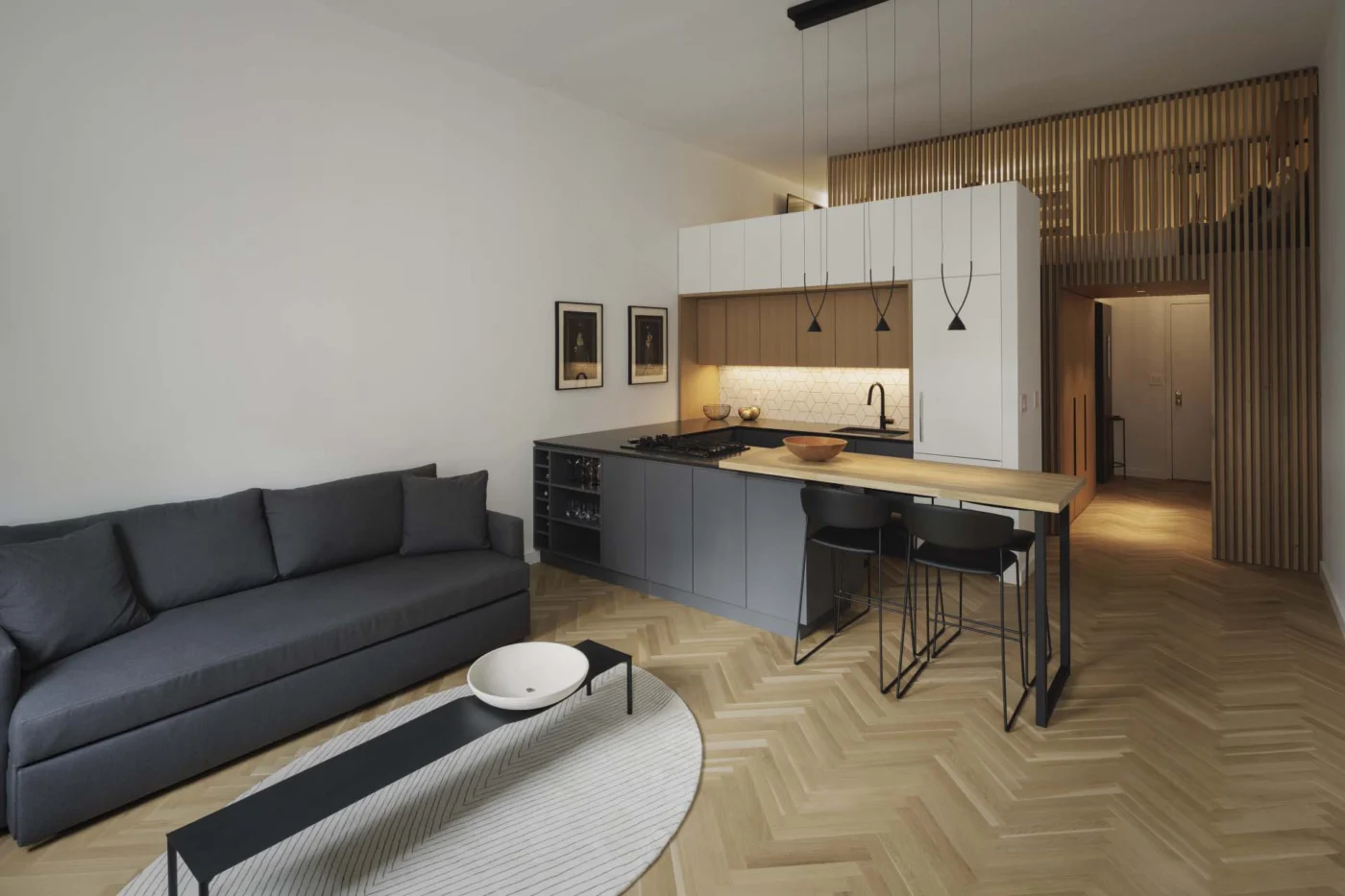 Renovated loft apartment with an open kitchen and herringbone oak floor