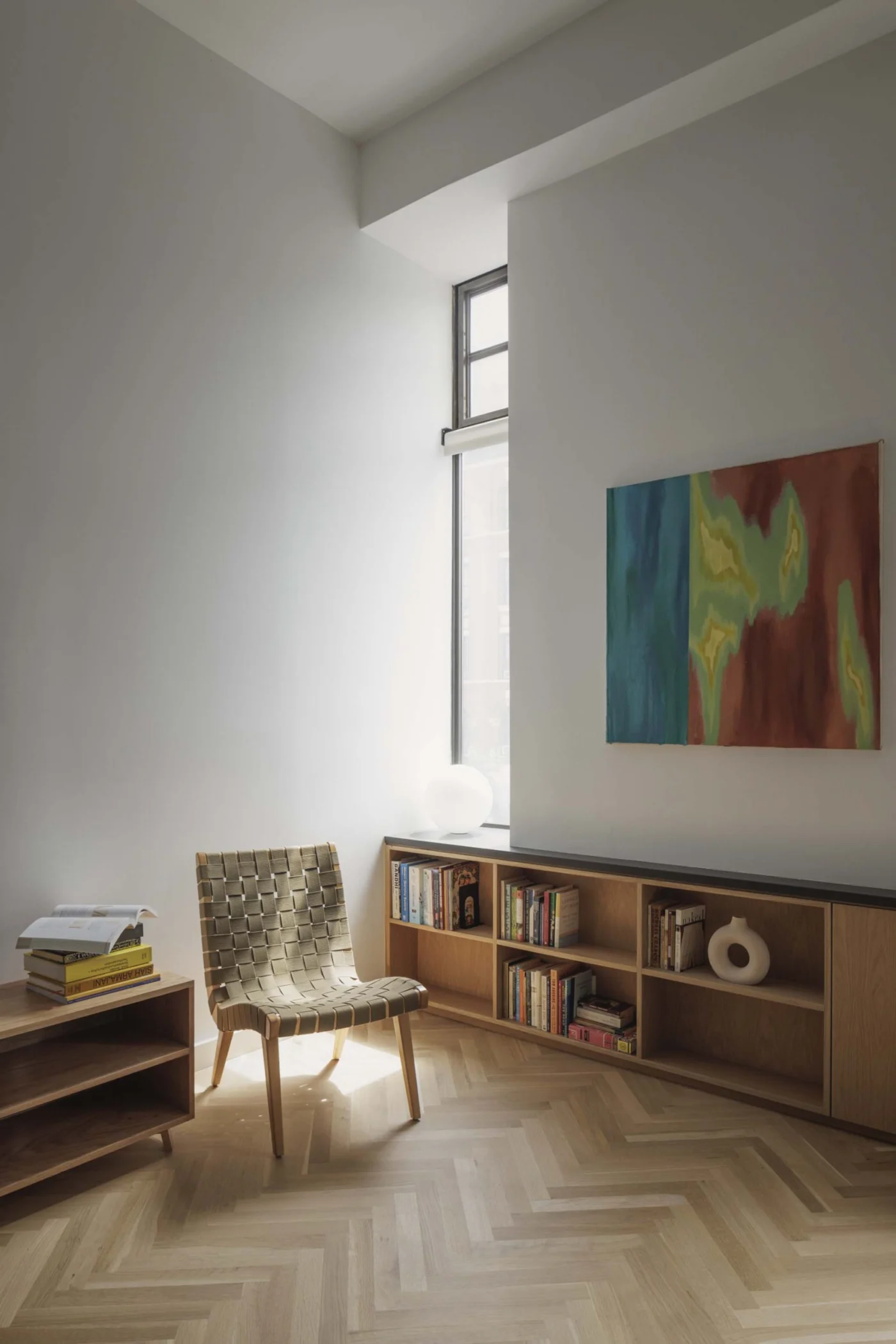 Living room with built-in open shelving along the wall