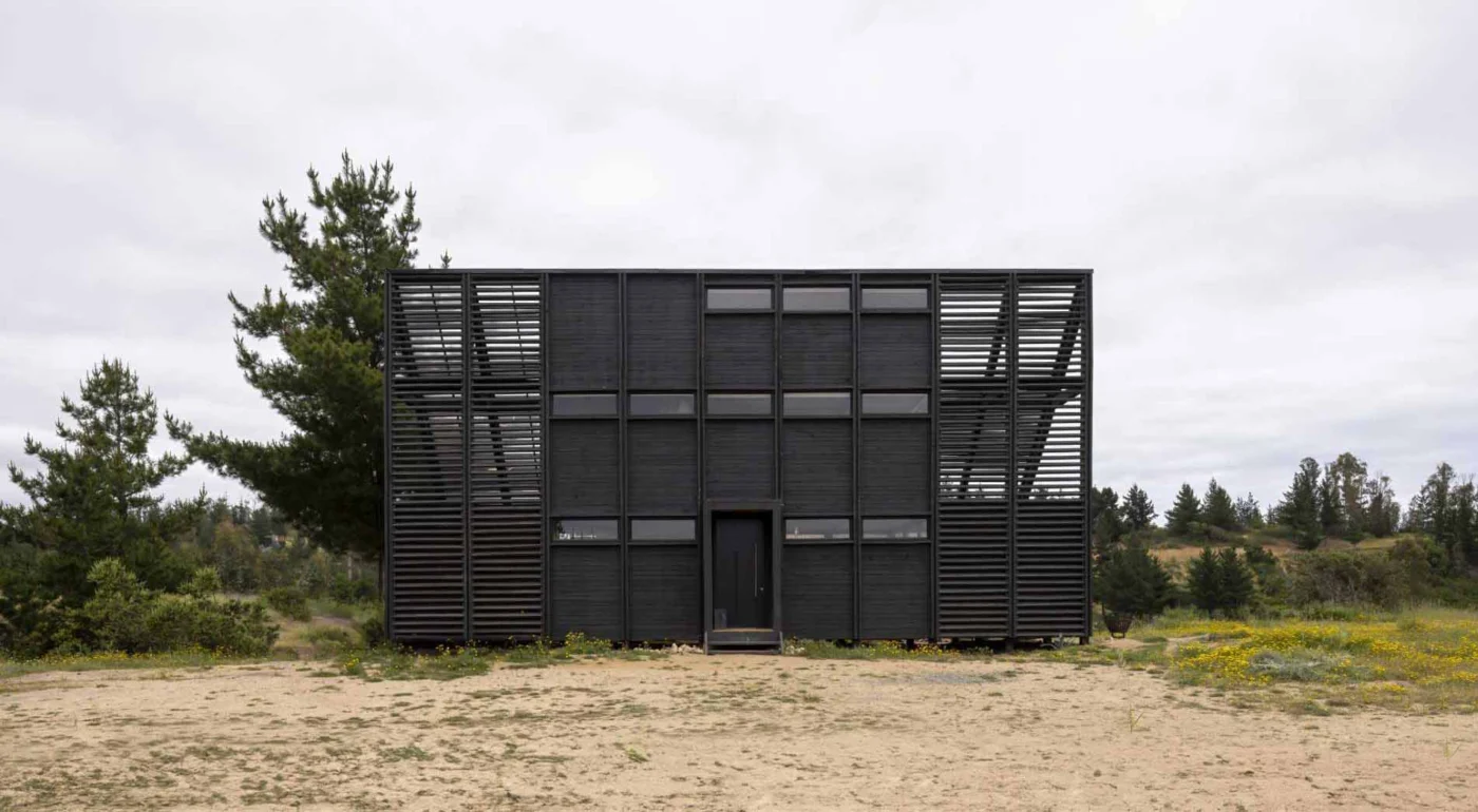 Long side of the black house showing its repeated modules