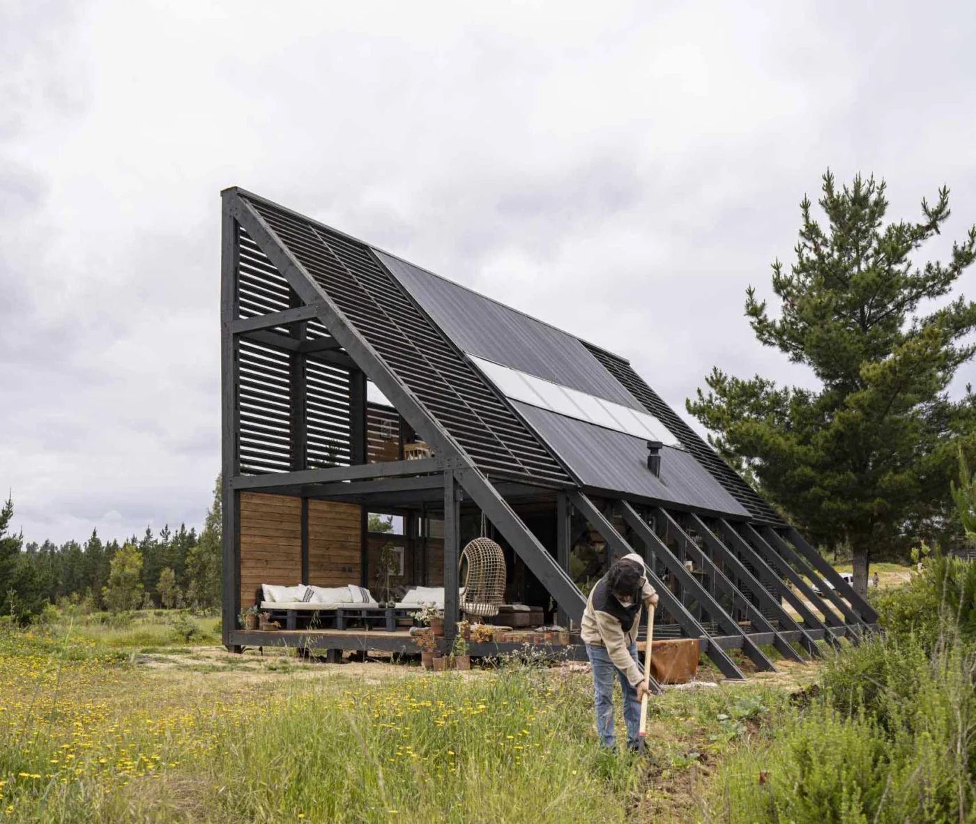 Sloping wedge profile with a deck tucked beneath the roof