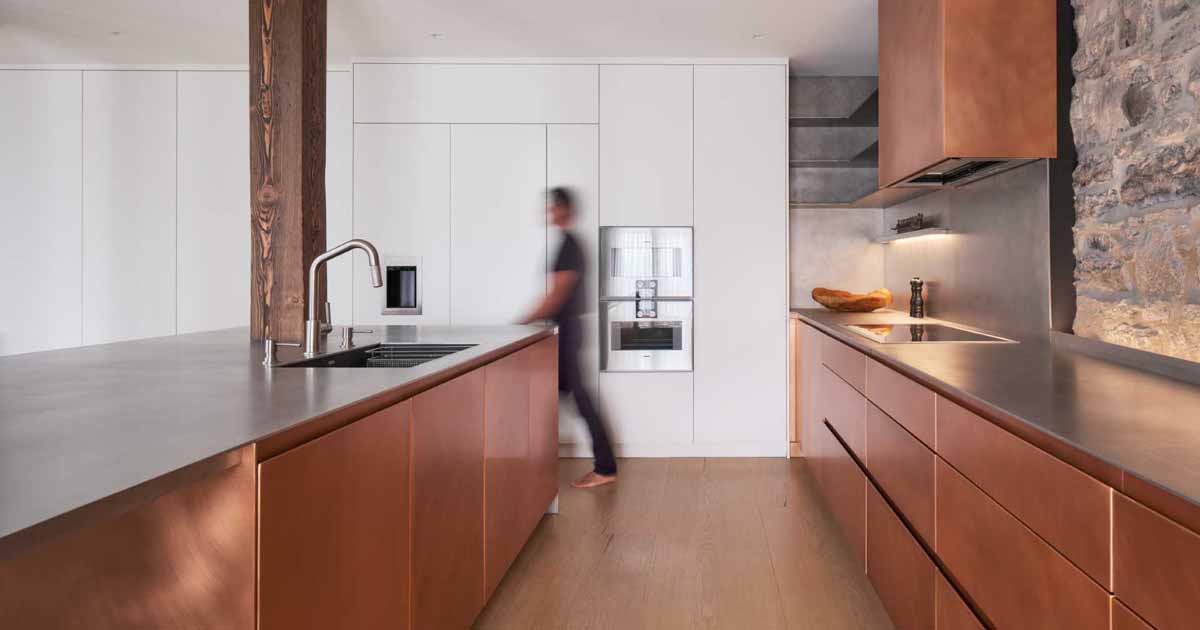 copper-kitchen-cabinets-add-to-the-refined-rustic-feeling-inside-this-renovated-historic-loft
