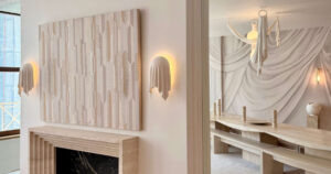 this-wall-light-looks-like-draped-fabric,-but-it’s-solid-plaster