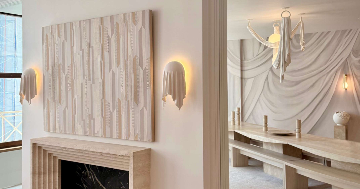 this-wall-light-looks-like-draped-fabric,-but-it’s-solid-plaster