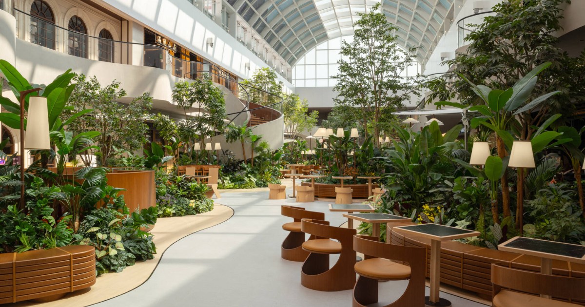 step-inside-this-indoor-garden-dining-plaza-filled-with-plants-and-pathways
