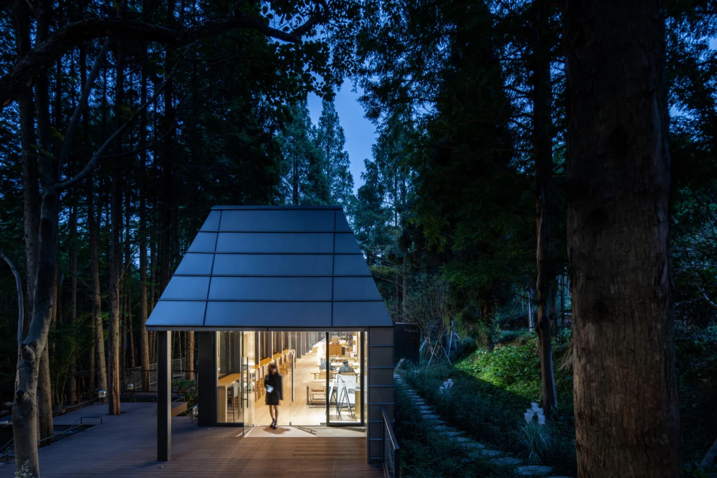 Clerestory windows drawing soft light from the bamboo grove into the reception