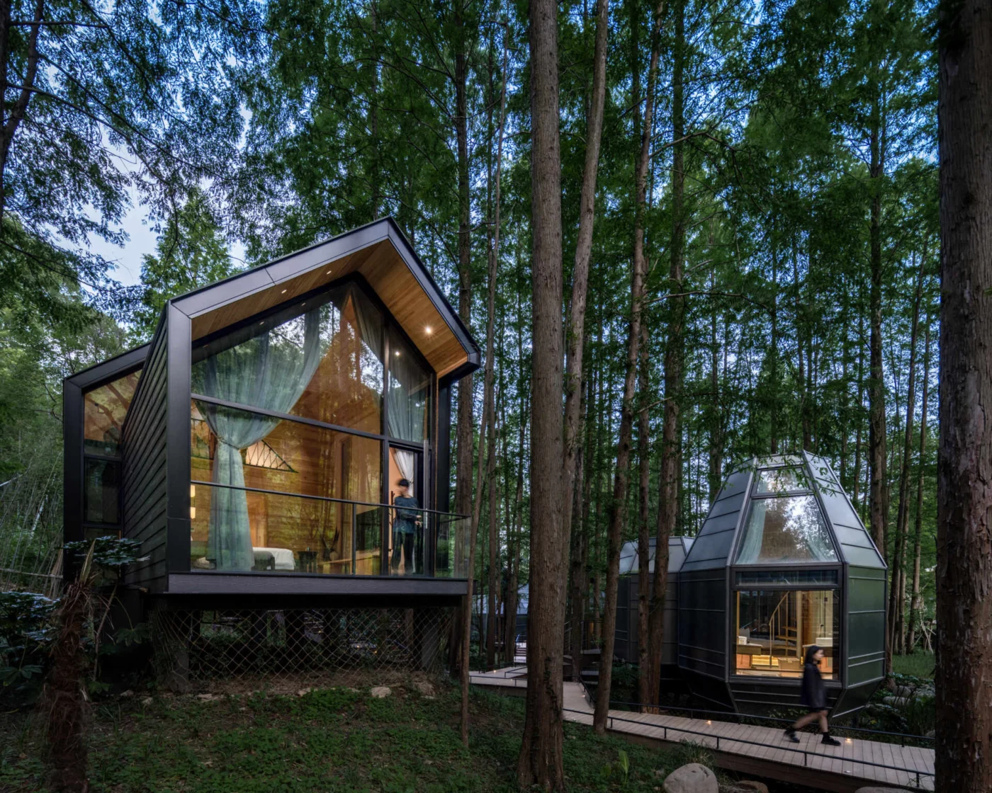 Timber-lined cottage with a steep double-pitched roof and skylights