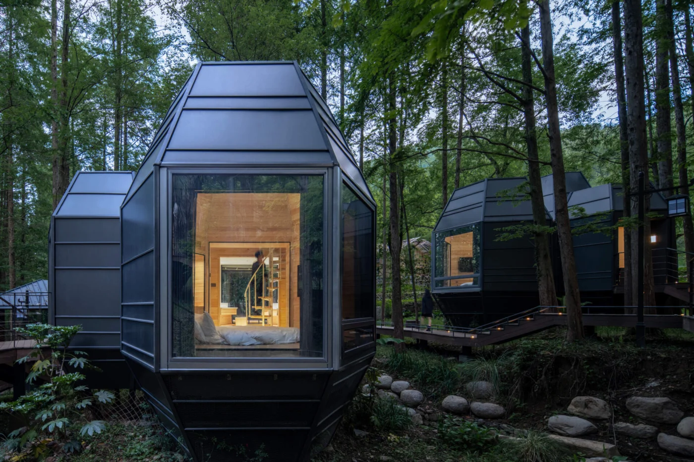 Modular Pinecone Cabins raised above the forest floor