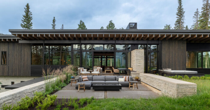 from-the-outside-this-home-is-all-blackened-wood,-but-inside-it-glows-with-warmth