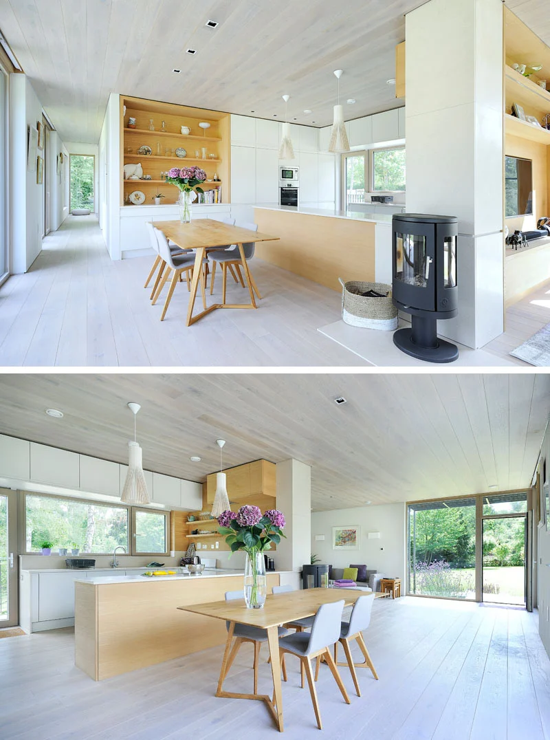 Dining area and kitchen around a central wood fire