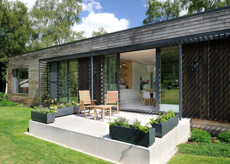Small patio with planters and seating outside the dining area