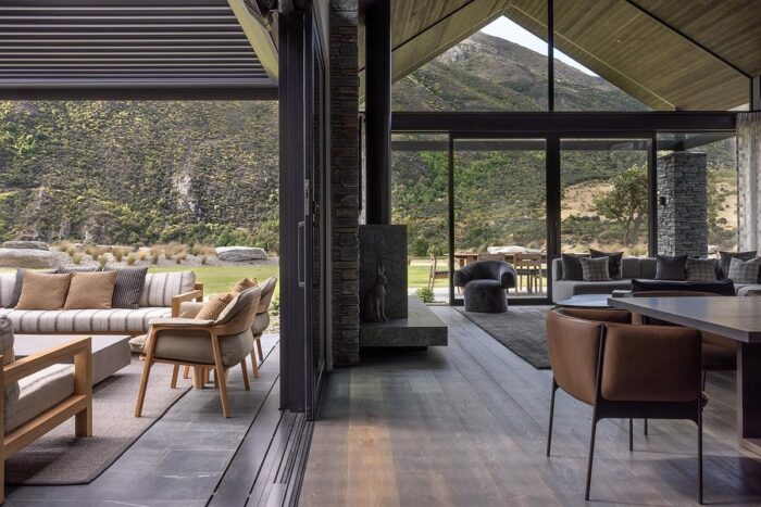 inside-a-stone-clad-home-that-frames-mountain-views