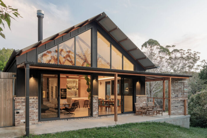 inside-the-wraparound-porch-home-glowing-at-golden-hour